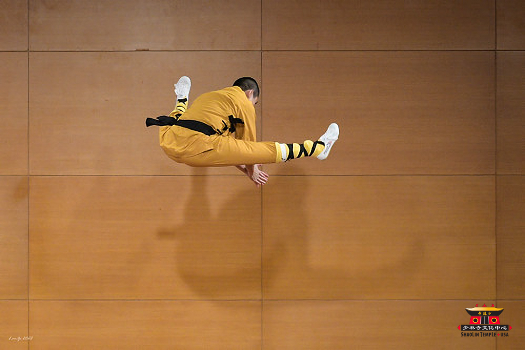 Shifu flying in air in a splits jump 